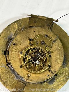 Small clock movement. Maker engraved, but not legible