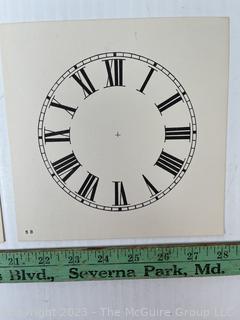 Large Group of Paper Clock Faces