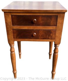 Sheraton Cross-Banded Two Drawer Stand Table with Turned Legs.  Stamped inside drawer "C.A. SP Undertaker and Dealer in all Kinds of Furniture. 1118 2nd St, Harrisburg, PA". Measures 17 x 19 x 30"