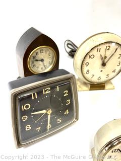 Eight (8) Travel Alarm Clocks