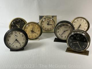 Seven (7) Travel Wind Up Alarm Clocks