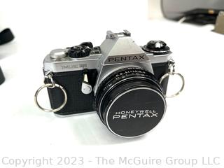 Pentax Film Camera with Multiple Lenses and Light Attachment