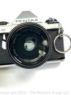 Pentax Film Camera with Multiple Lenses and Light Attachment