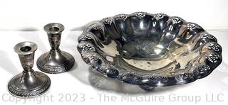 Silver Plate Pierced Serving Bowl and Two Sterling Silver Weighted Candlesticks. 