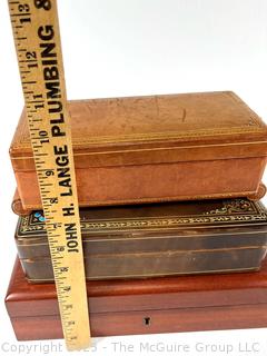 Three (3) Trinket Jewelry Boxes in Leather and Wood. Music box