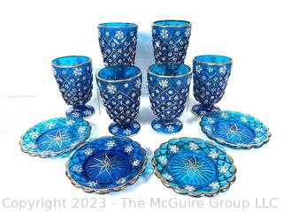 Set of Blue Depression Glass Plates and Goblets Decorated With Flowers And Gold