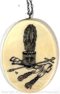 Hand Carved Scrimshaw Pendant with West Point Hat and Swords 