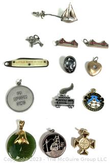 Twelve (12) Charms or Pendants and One Sterling Sailboat Pin