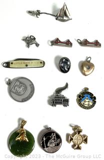 Twelve (12) Charms or Pendants and One Sterling Sailboat Pin