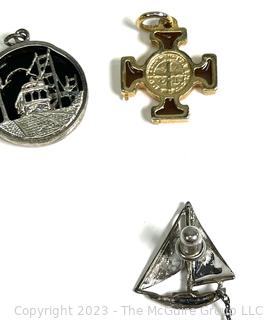 Twelve (12) Charms or Pendants and One Sterling Sailboat Pin