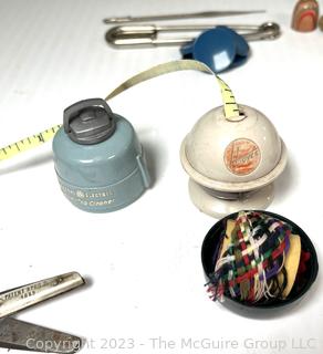 Vintage Sewing Supplies Including General Electric and Hoover Promotional Measuring Tapes and Thimble Kit.