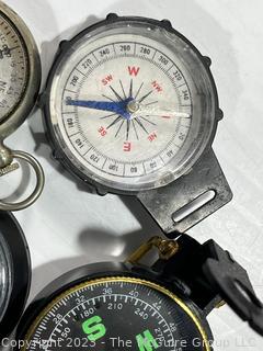 Four (4) Compasses Including WWII Military