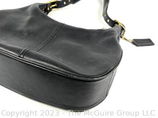 Black Leather Classic Coach Hand Bag with Hang Tag.
