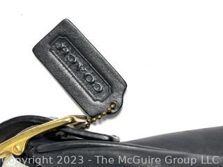 Black Leather Classic Coach Hand Bag with Hang Tag.
