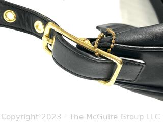 Black Leather Classic Coach Hand Bag with Hang Tag.
