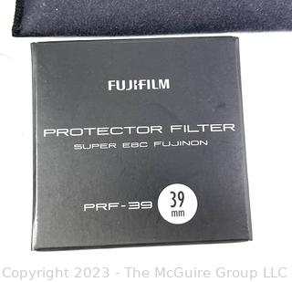 Camera: Like New with Original Boxes Fuji X-Pro 1 Digital 16.3 Mega Pixel Digital Camera w/ F35mm Lens; Extras: EF-X20 flash; Battery/Recharger; XF 18mm F2 Lens; XF 60mm F2.4 R Macro Lens; Manfrotto Mono-Pole, Filter Pack