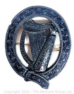 Victorian Round Irish Bog Turf Carved Harp Brooch.