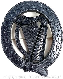 Victorian Round Irish Bog Turf Carved Harp Brooch.