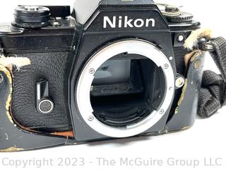 Nikon EM Film Camera with (2) Series E Lenses: 28MM 1:1.28 and 50MM 1:1.8 plus Flash Attachment