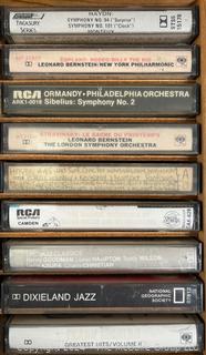 Collection of Vintage Cassette Tapes and Wooden Box