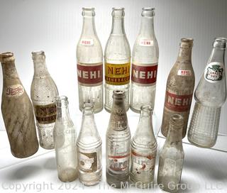 Collection of Clear Soda Glass Bottles Including Nehi