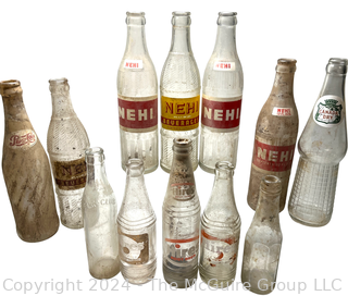 Collection of Clear Soda Glass Bottles Including Nehi