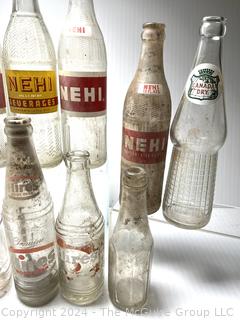 Collection of Clear Soda Glass Bottles Including Nehi