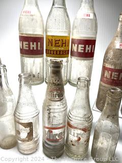 Collection of Clear Soda Glass Bottles Including Nehi