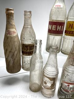 Collection of Clear Soda Glass Bottles Including Nehi