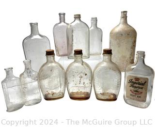 Group of Clear Whiskey Bottles and Flasks