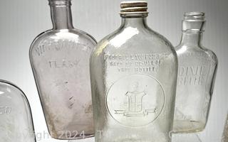 Group of Clear Whiskey Bottles and Flasks