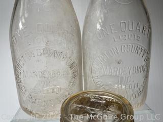 Five (5) Clear Glass Bottles Including (2) Arlington County Dairy (ACD) VA Marcey Bros. Inc, Clarendon Clear Quart Milk Bottles