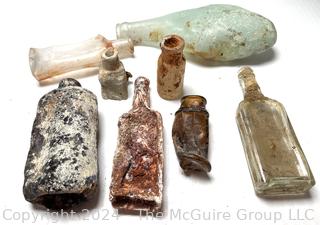 Collection of Melted Bottles from Privy Dig