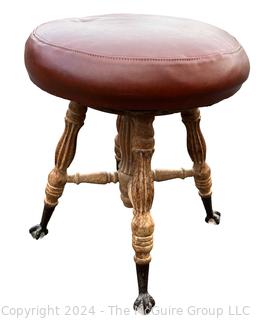 Victorian Piano Stool with Claw Feet Holding Glass Ball. 18" tall.