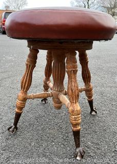 Victorian Piano Stool with Claw Feet Holding Glass Ball. 18" tall.