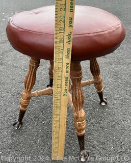 Victorian Piano Stool with Claw Feet Holding Glass Ball. 18" tall.