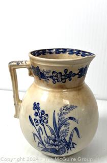 Three (3) Pieces of Blue and White Transferware Including Pitcher, Creamer and Sugar.