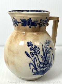 Three (3) Pieces of Blue and White Transferware Including Pitcher, Creamer and Sugar.