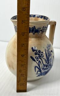 Three (3) Pieces of Blue and White Transferware Including Pitcher, Creamer and Sugar.