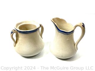 Three (3) Pieces of Blue and White Transferware Including Pitcher, Creamer and Sugar.