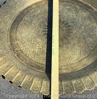 Large Etched Moroccan Brass Serving Tray with Fluted Edge on Wood Folding Base. 40" diameter.