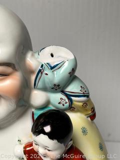 Chinese Porcelain Laughing Buddha With Five Children Statue.  12" tall