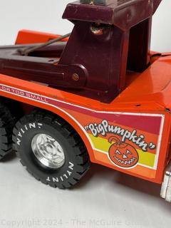 Two (2) Metal Toy Trucks Including Tonka Snorkel Fire Truck and NYLINT 'Big Pumpkin' Tow Truck