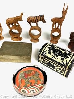 Carved African Napkin Rings, Carved Horn Serving Spoons, Inlaid and Silver Plated Box, Glass Paperweight and Chinese Pottery Foo Dog Figurine.