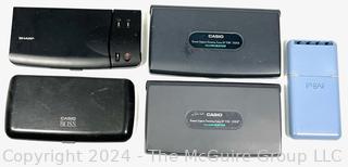 Four (4) Retro Sharp & Casio Data Storage Devices (untested) and Pen Set