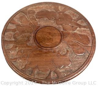 Carved Wood Tripod Table From Zimbabwe with African Wooden Disc With Six Men Seated.