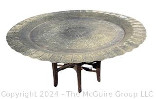 Large Etched Moroccan Brass Serving Tray with Fluted Edge on Wood Folding Base. 40" diameter.