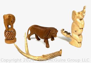 Three (3) Carved Wooden Souvenir Figurines and One (1) Deer Antler