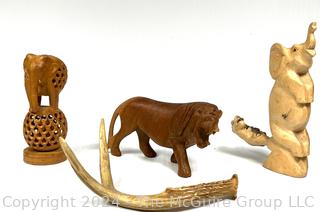 Three (3) Carved Wooden Souvenir Figurines and One (1) Deer Antler