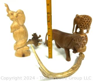 Three (3) Carved Wooden Souvenir Figurines and One (1) Deer Antler